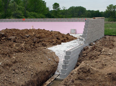 May 26, 2009 - The masons have set 14 courses of block around most of the perimeter.