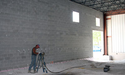 July 6, 2009 - A two-part expanding foam insulation material is being injected into the walls.